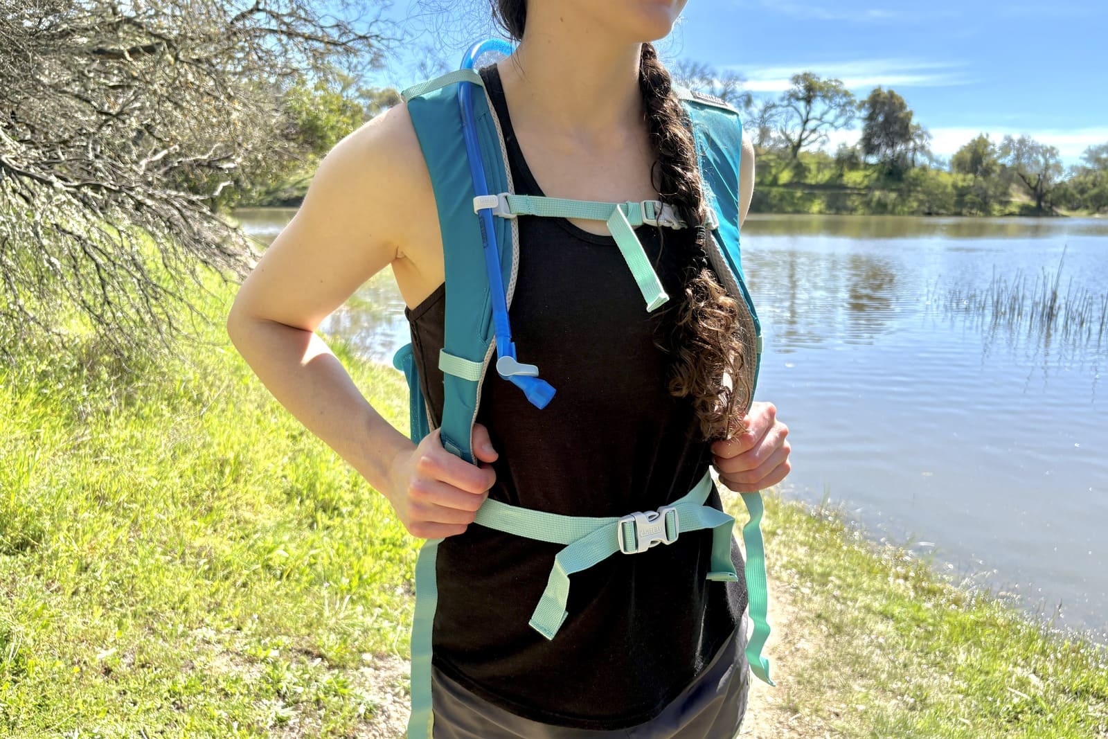Close up, showing the front of a hydration pack while worn.