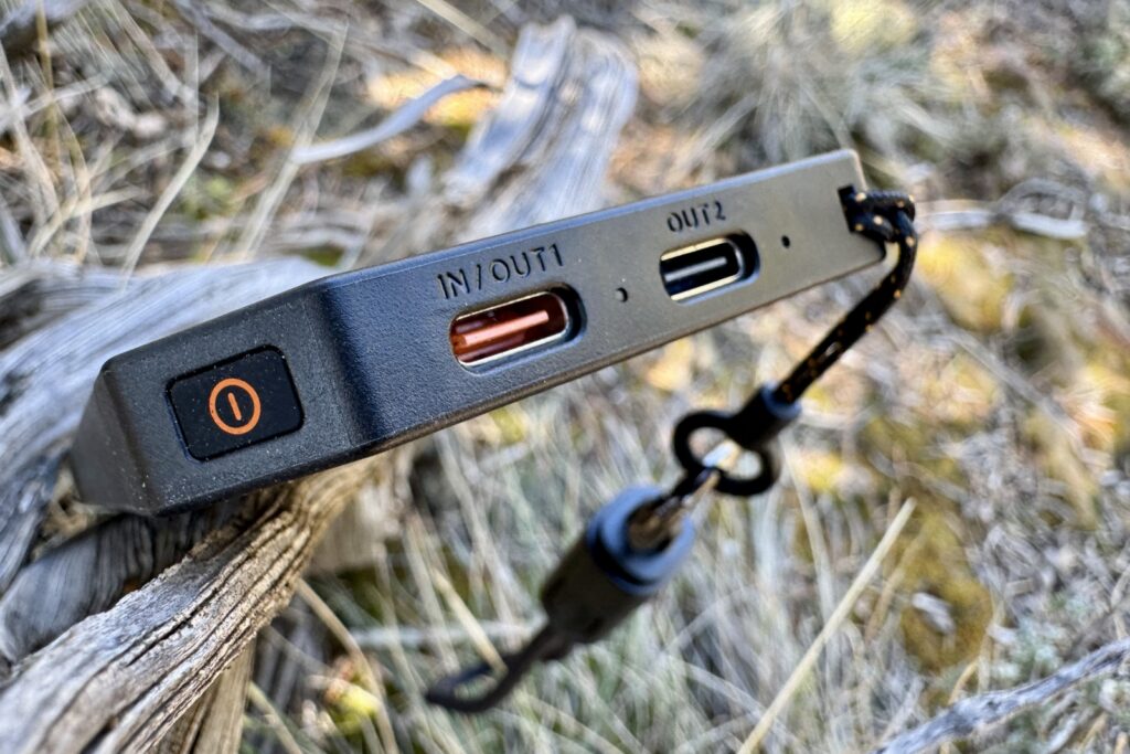 Close up of the Flextail ports. It is sitting on a stick with grass in the background.