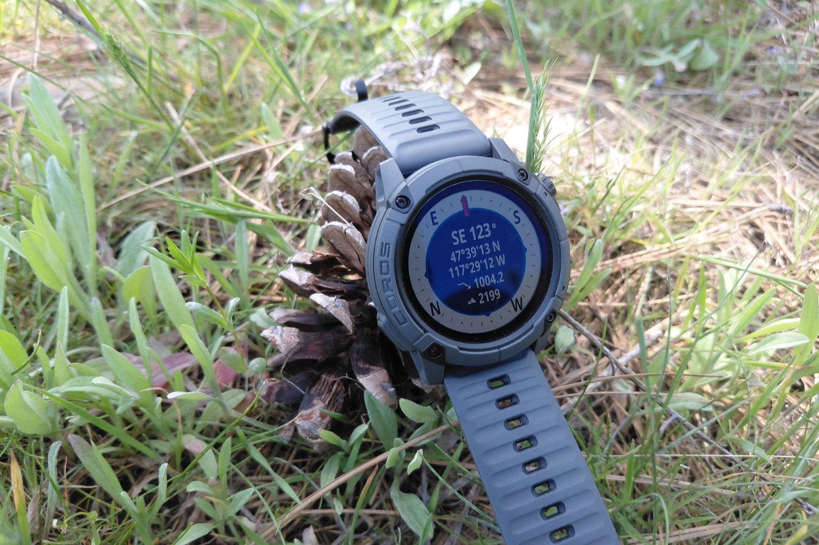 A close-up of the compass on a GPS watch.