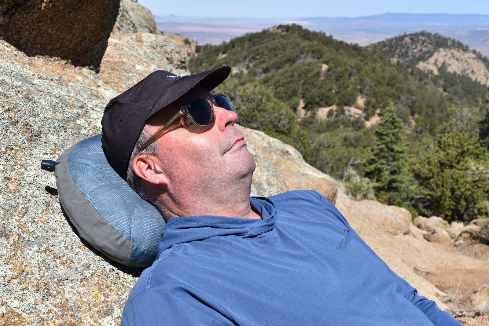 Resting against a cliff with the Air Head Down pillow behind our head and neck.