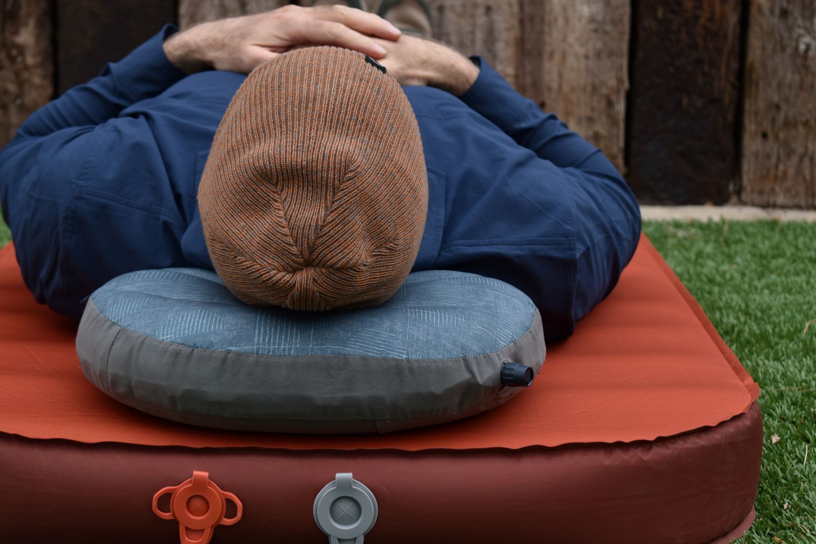 A tester evaluating the comfort and support of the Air Head Down while lying on his back.