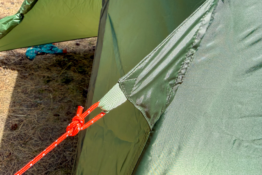 Close-up of the Kelty Wireless 6 tent's guyline attachment point and reinforced rainfly tie-out.