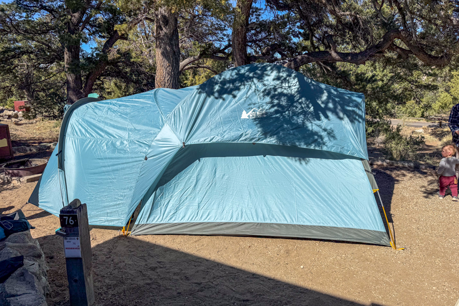 Side view of the REI Co-op Westward 6 with the partial rainfly installed at a campground.