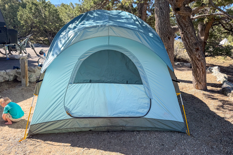 Rear view of the REI Westward 6 tent with the partial rainfly in place and rear door closed.