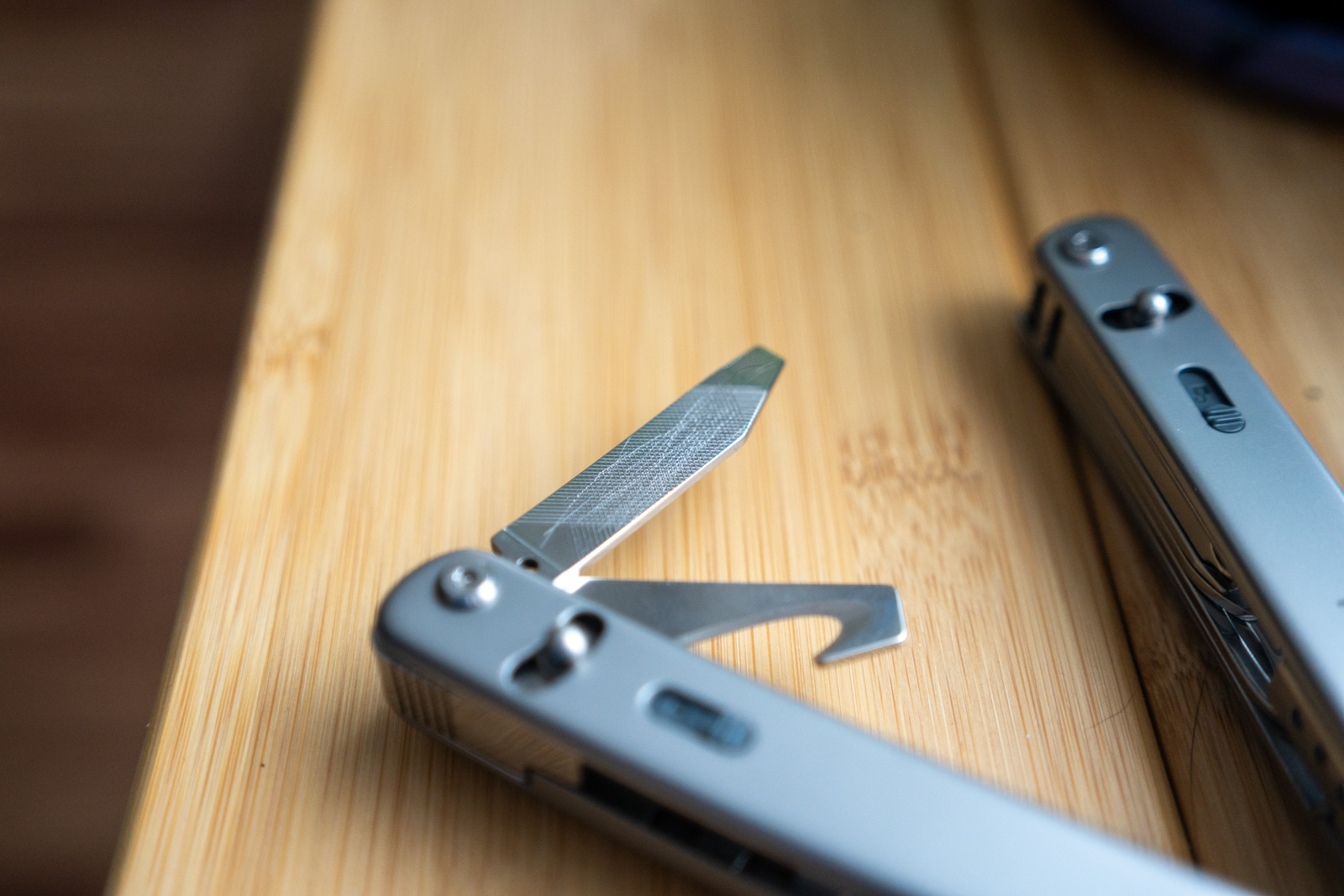 A multi tool with the file extended shows scratches