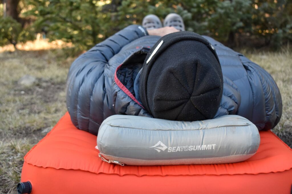 Close up of the Aeros Down Pillow under our male tester's head in the Pecos Wilderness.