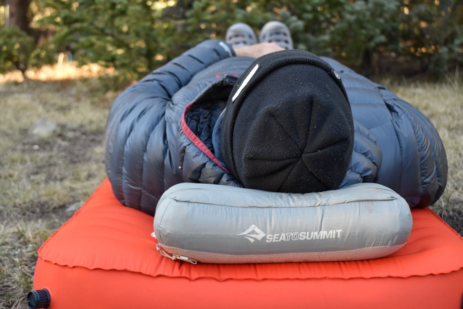Close up of the Aeros Down Pillow under our male tester's head in the Pecos Wilderness.