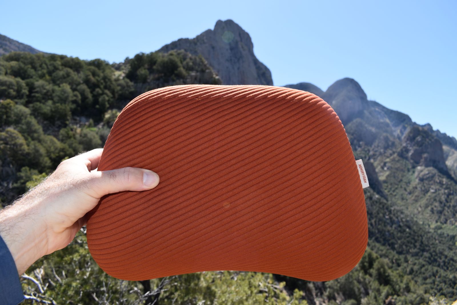Holding up the Aeros Premium pillow on a hike in New Mexico's Sandia Mountains.