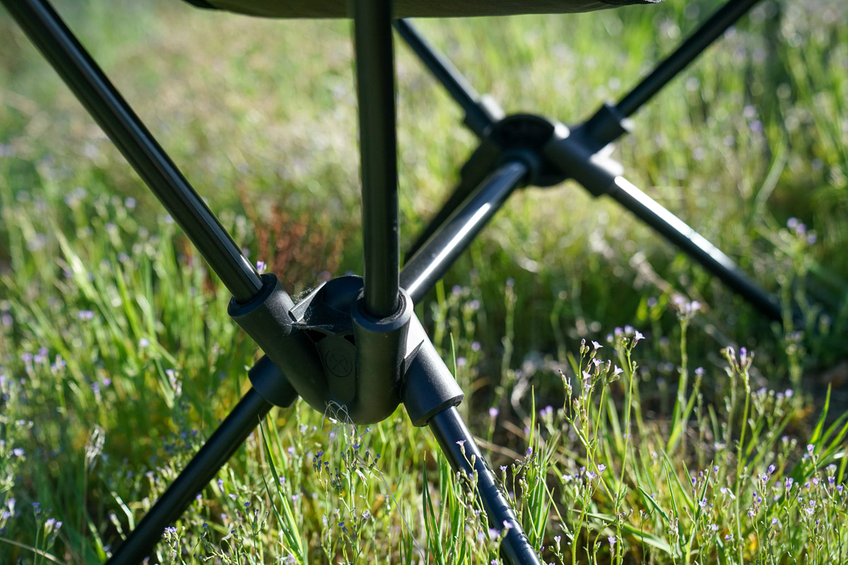 A close up of the collapsible frame of a camping chair.