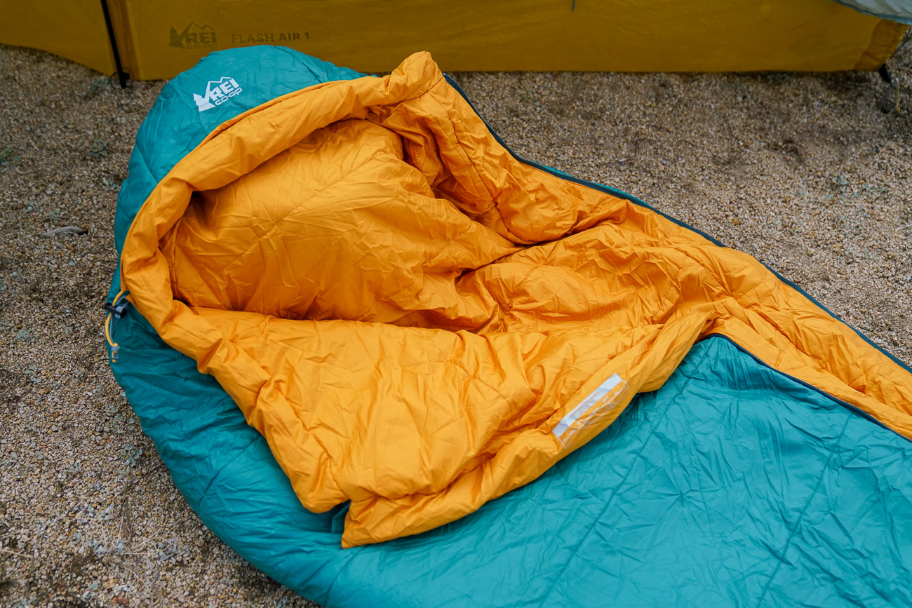 A close up of the top half of a sleeping bag.