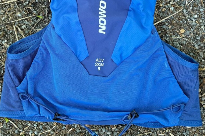 Close-up of the trekking pole attachments on the Salomon ADV Skin 5 running vest.