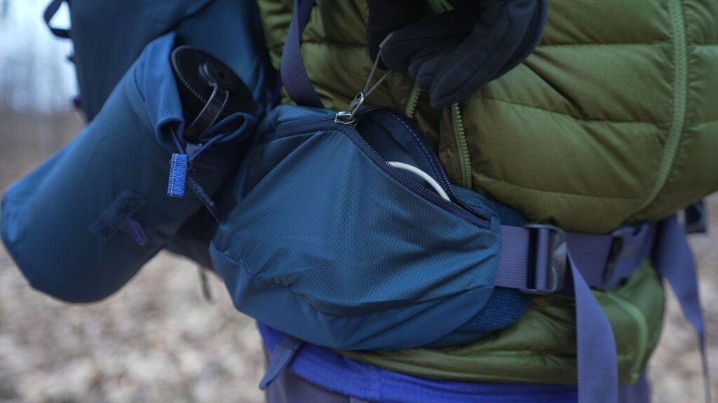 A hit pocket on a backpack is closed with a zipper