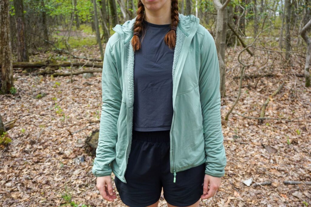 Woman stands in boxier jacket