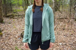 Woman stands in boxier jacket