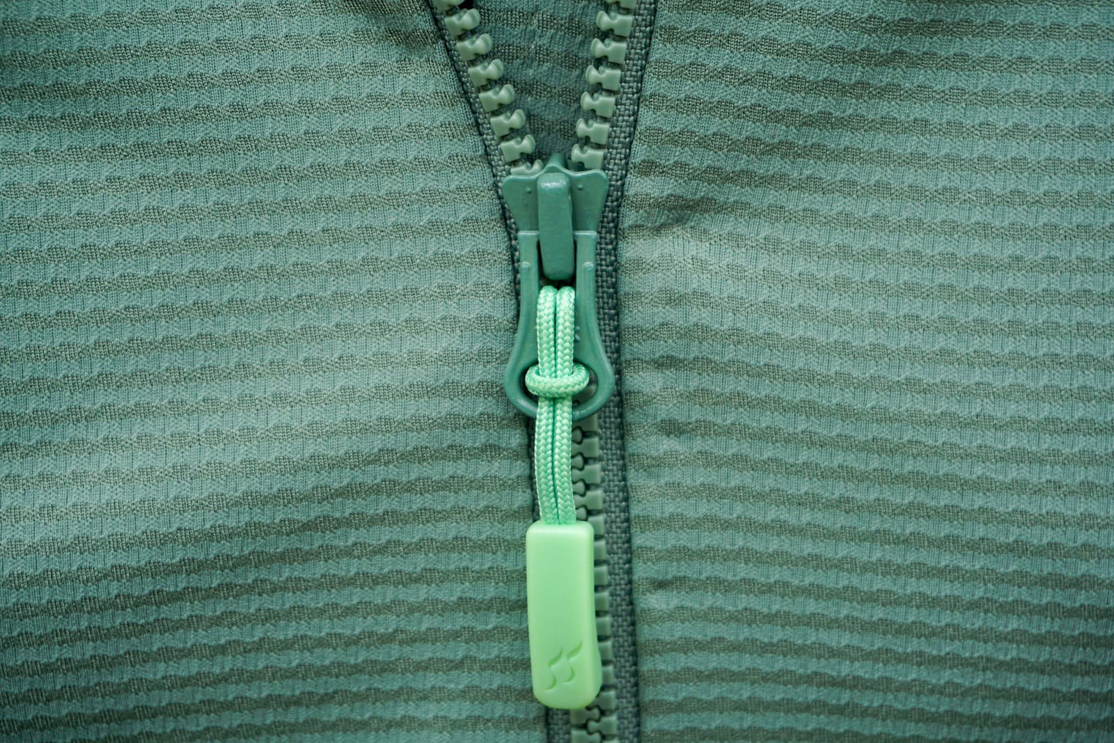 Close-up of zipper hardware on a hoodie.