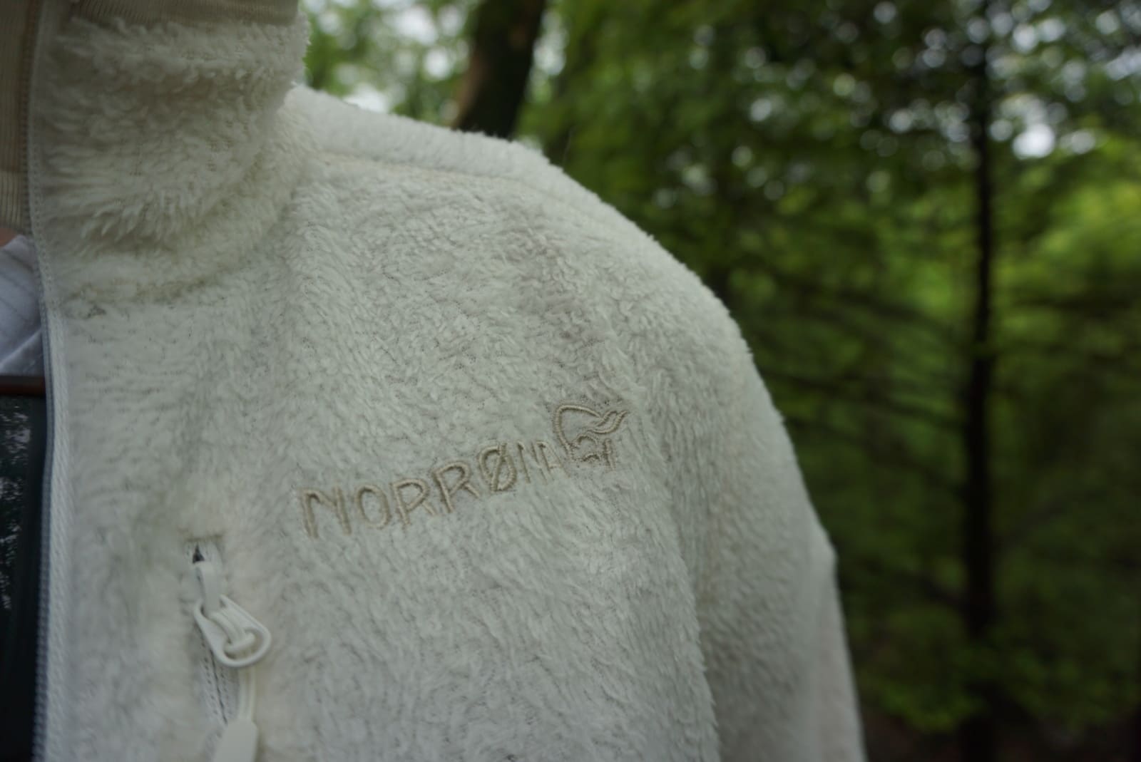 Close-up of Norrona logo on the fuzzy fabric of the jacket
