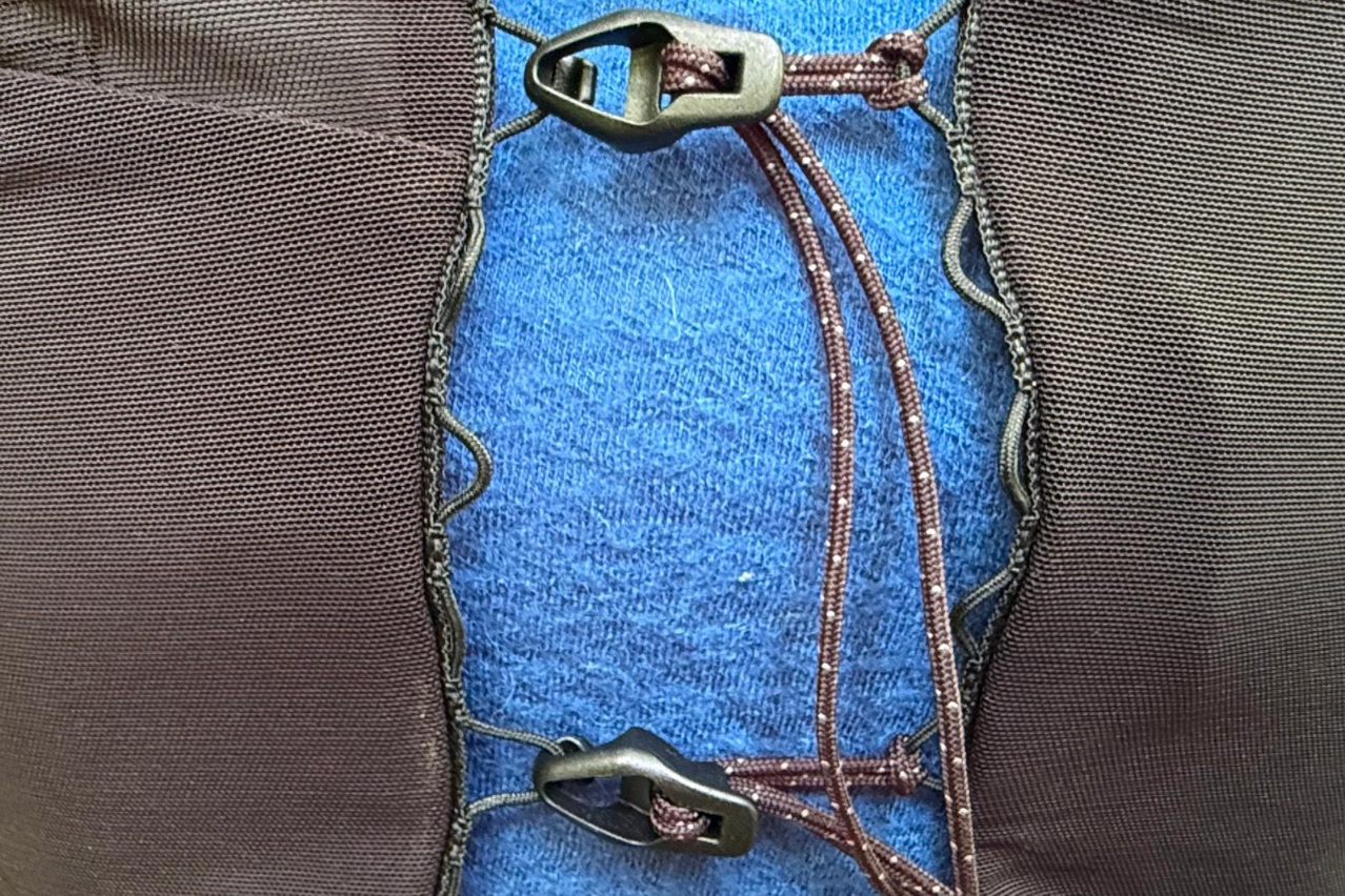Close-up image of the sternum closure on a black running vest.