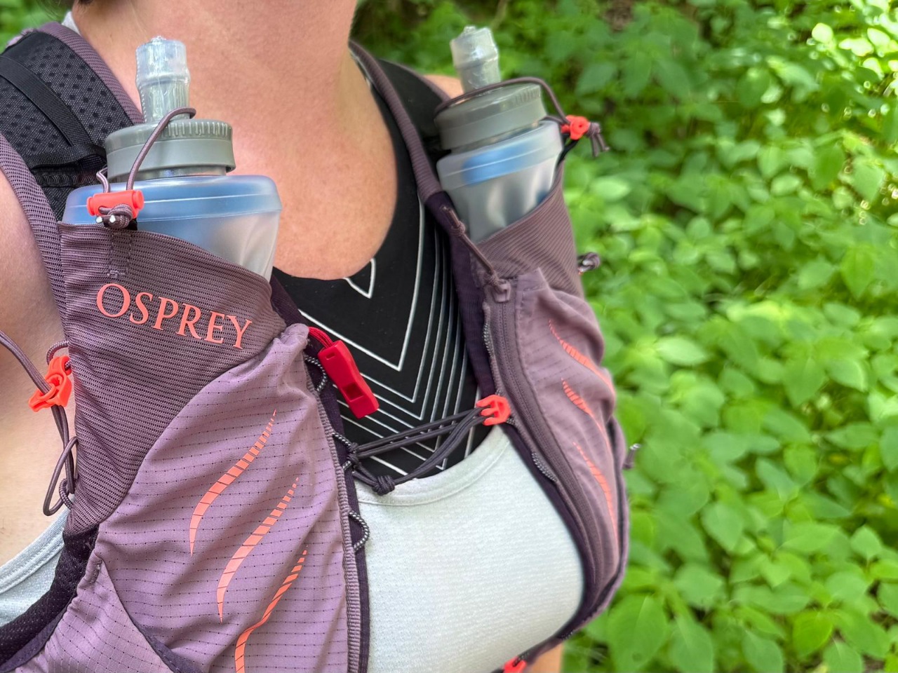 Close-up image of the water flask pockets on a purple running vest.