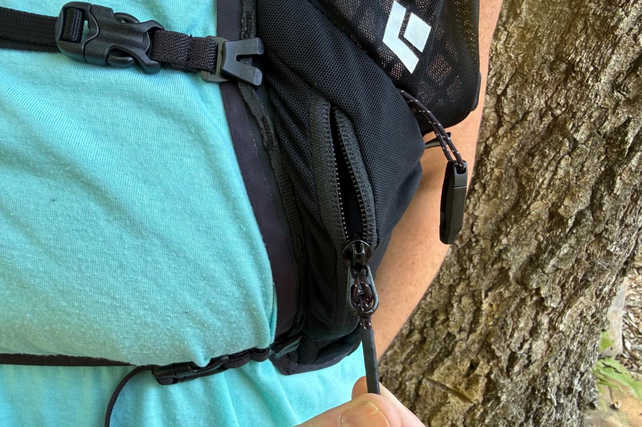 Close-up image of a zippered pocket on a running vest.