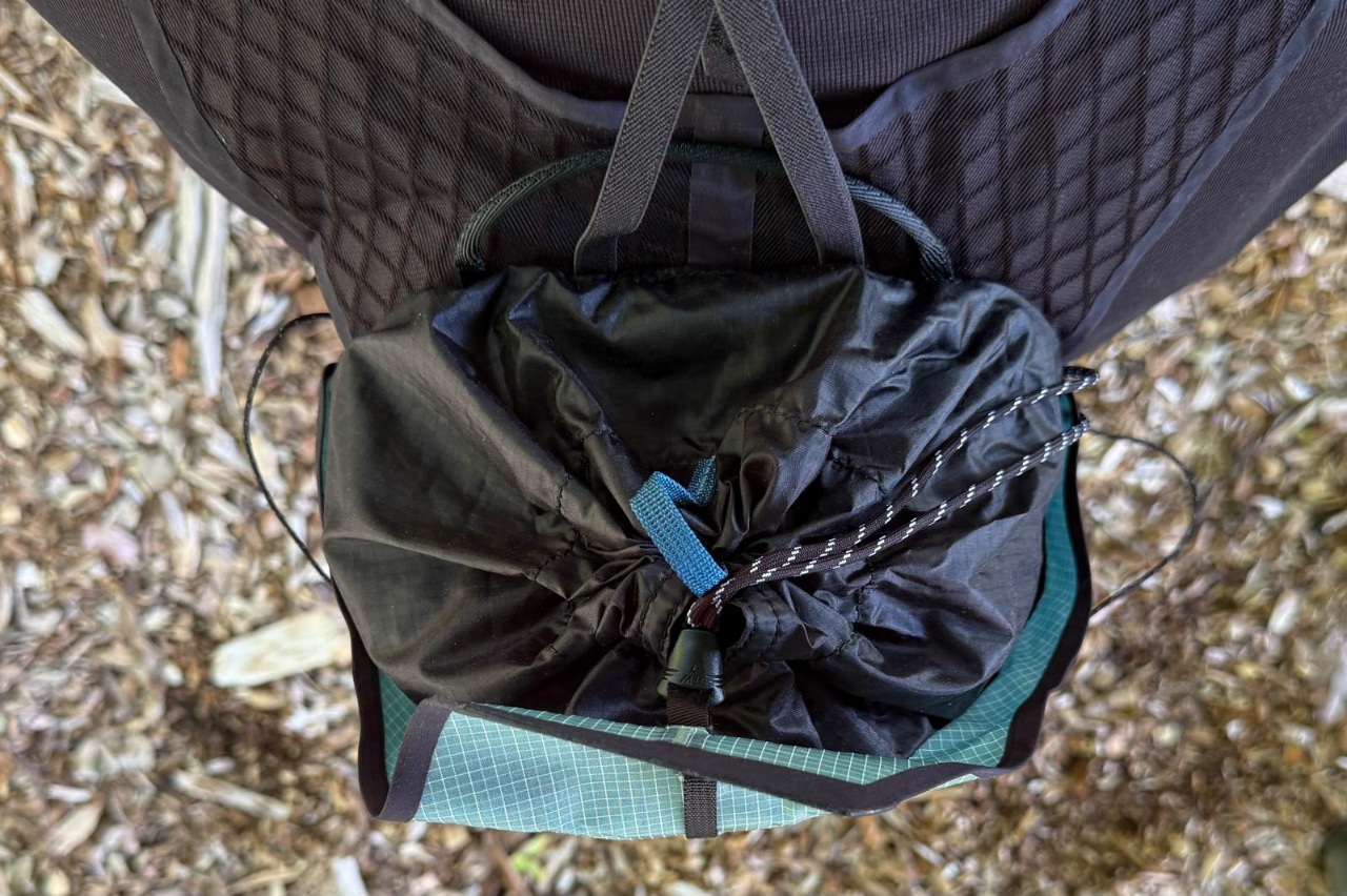 Close-up image of a drawcord closure on a day pack/running vest.
