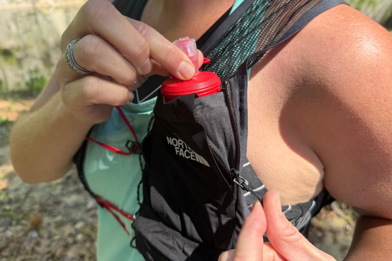 Close-up image of the flask pocket on a black running vest.