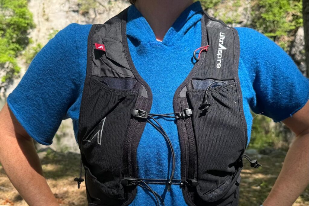 Close-up image of the front of a black running vest.