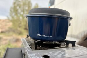 a blue pot on a camp stove