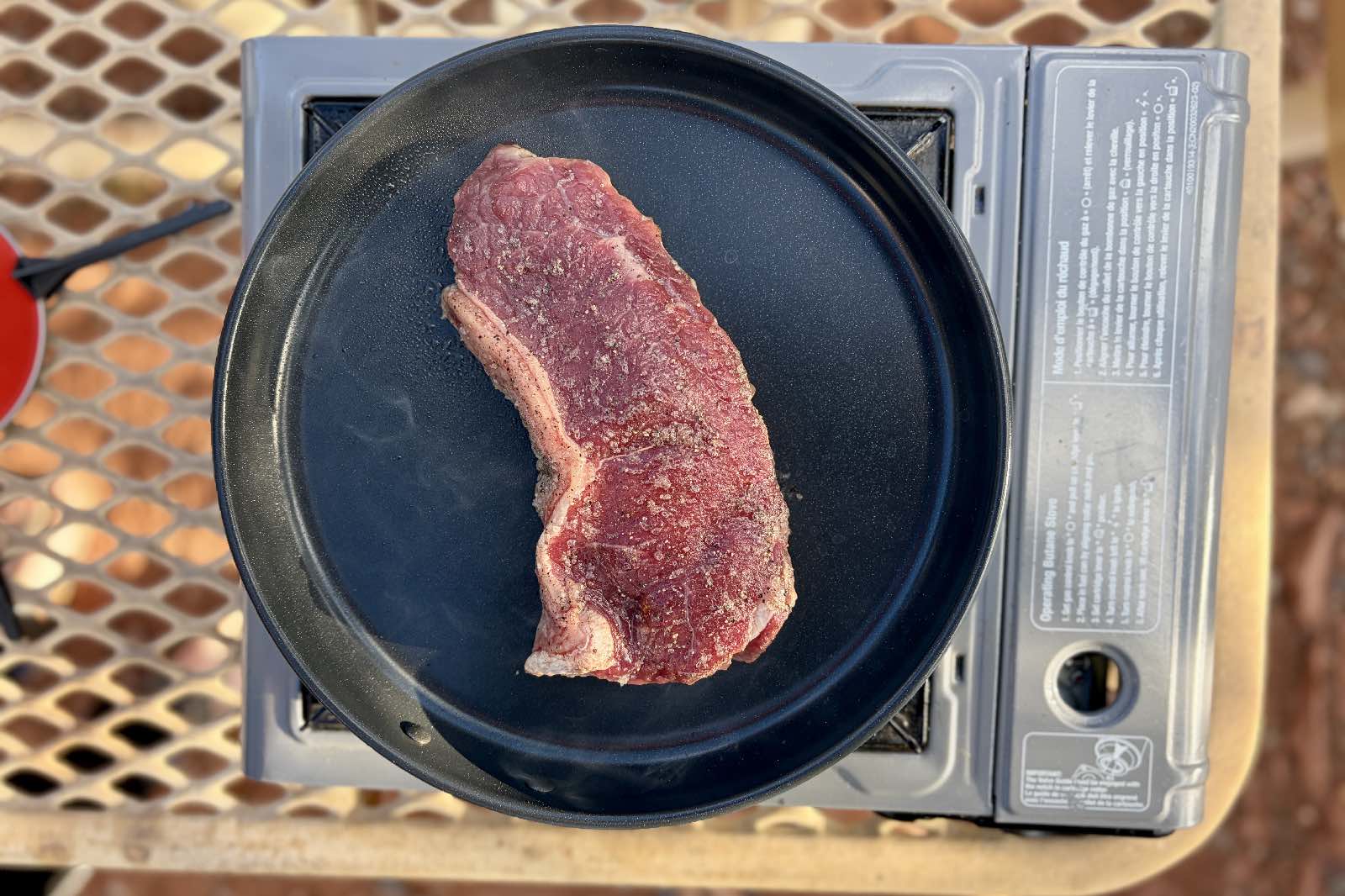 an aerial view a piece of stake on a skillet