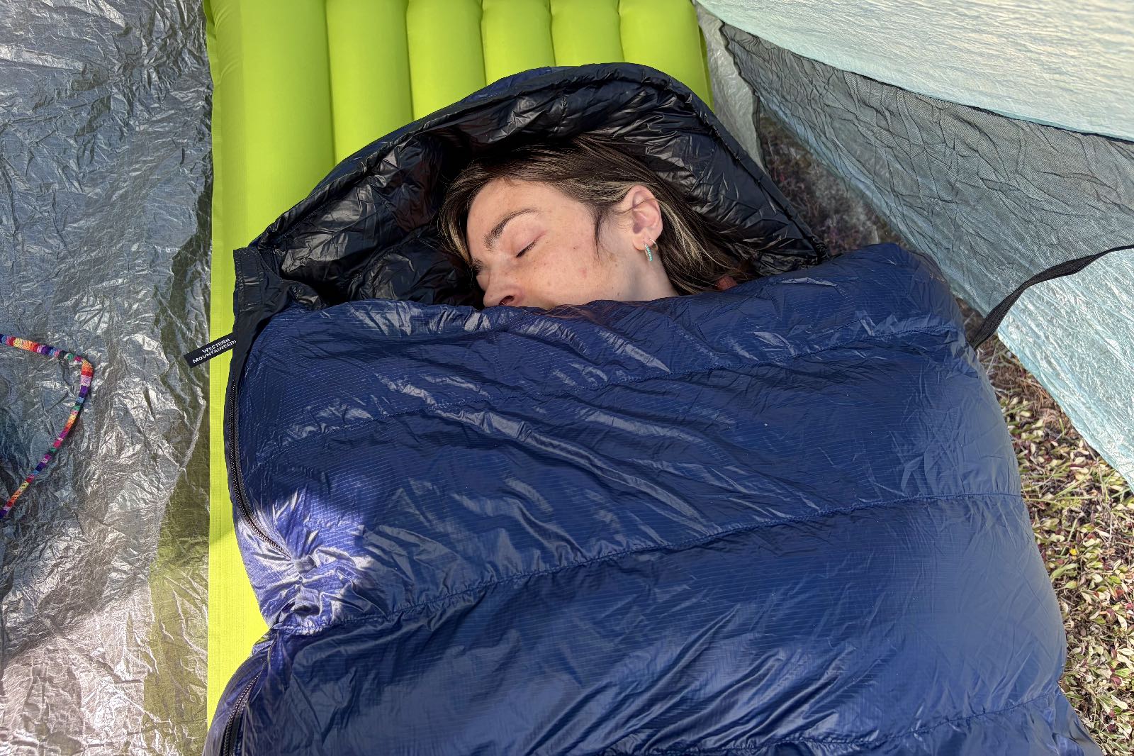 an aerial view of a hiker in a sleeping bag
