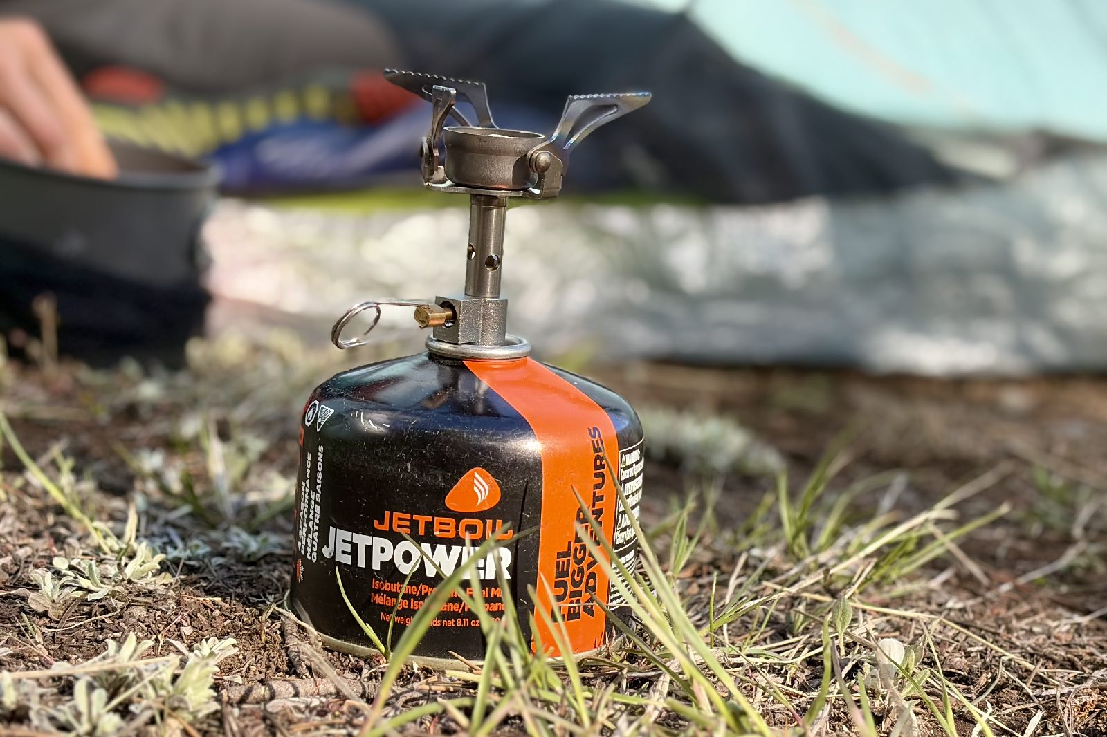 Close-up image of a backpacking stove on a fuel canister.