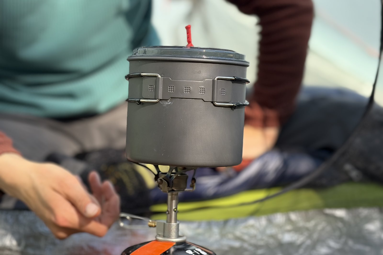 a cookpot sits on a backpacking stove