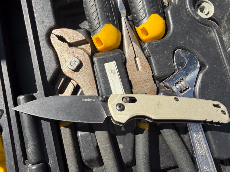 Kershaw Bel Air open in a toolbox among hand tools to show everyday carry and utility use.