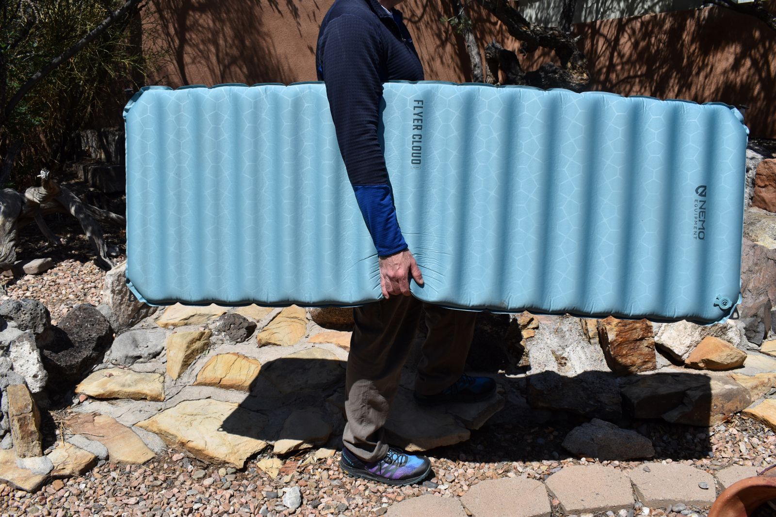 Our tester carries the inflated NEMO Flyer Cloud under one arm