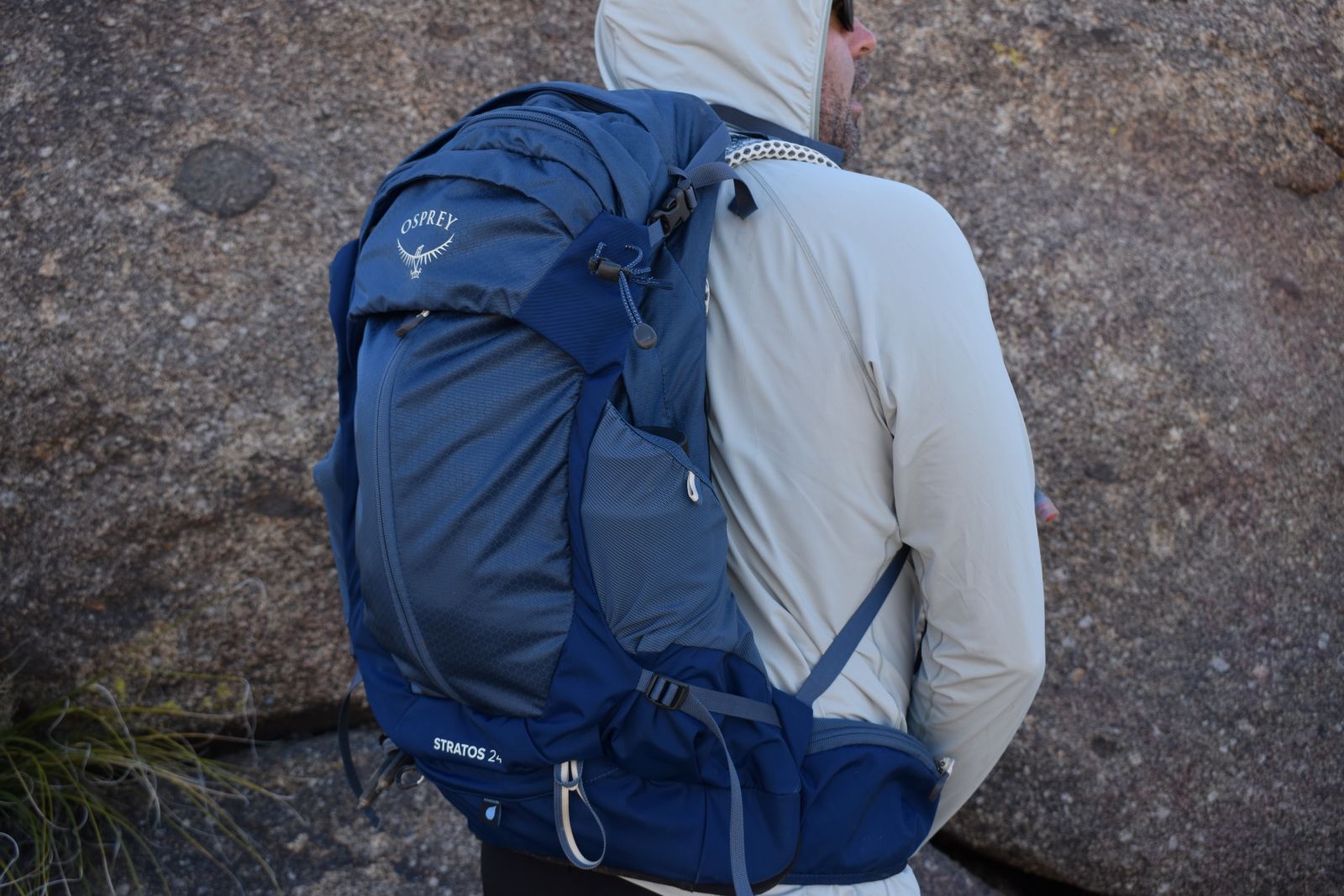 Rear view of the supportive Osprey Stratos on the back of a CleverHiker editor
