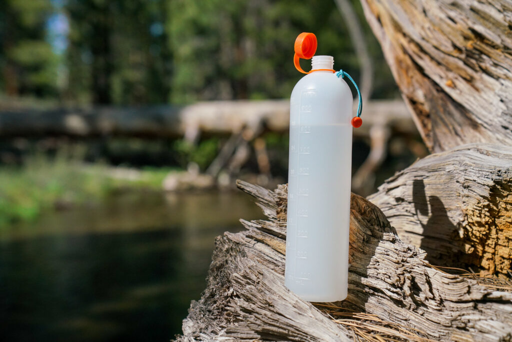 A close up of an open water bottle.