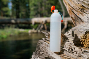 A close up of an open water bottle.