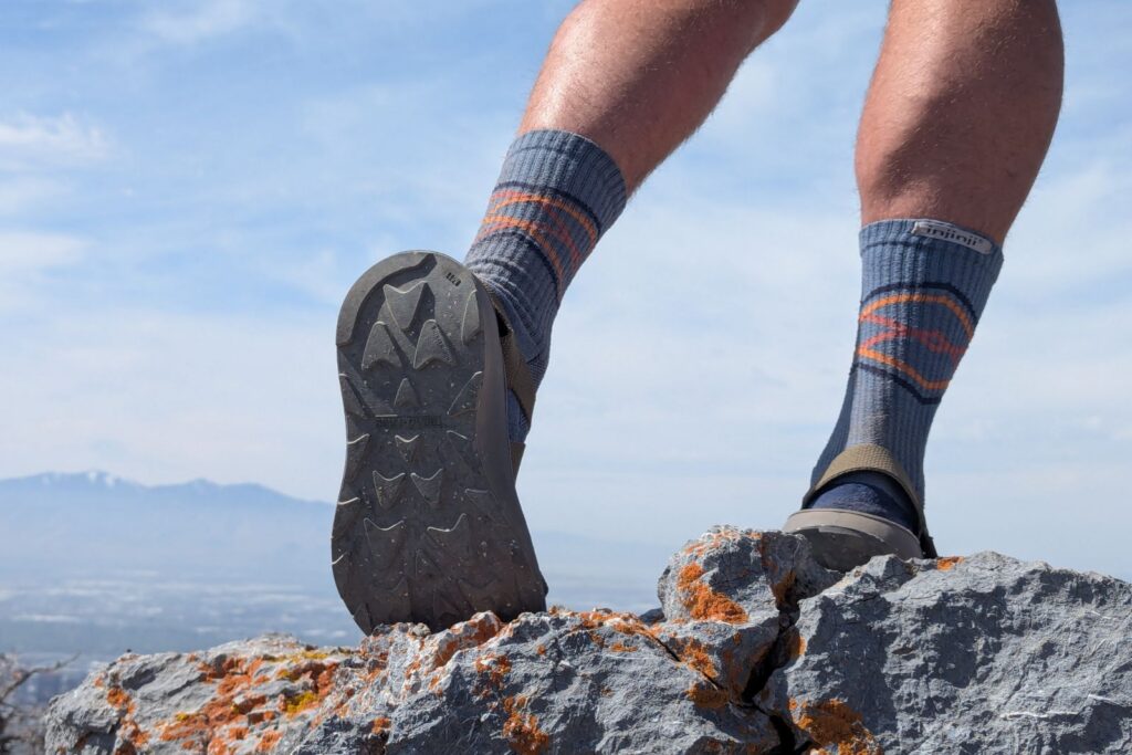 Showing off the tread of the Tread Lab Redway sandals above Salt Lake City.