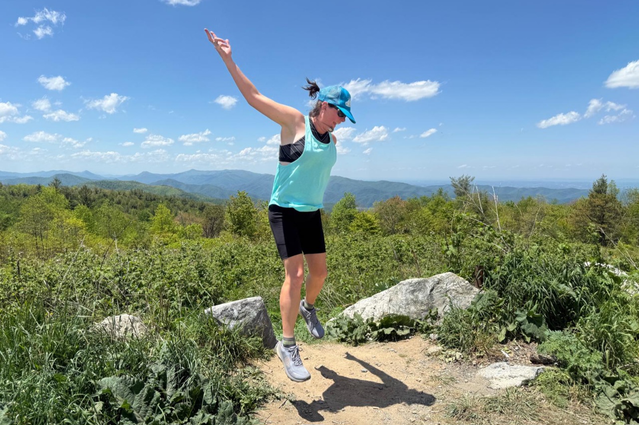 Runner jumping off a rock wearing the Topo Terraventure 5
