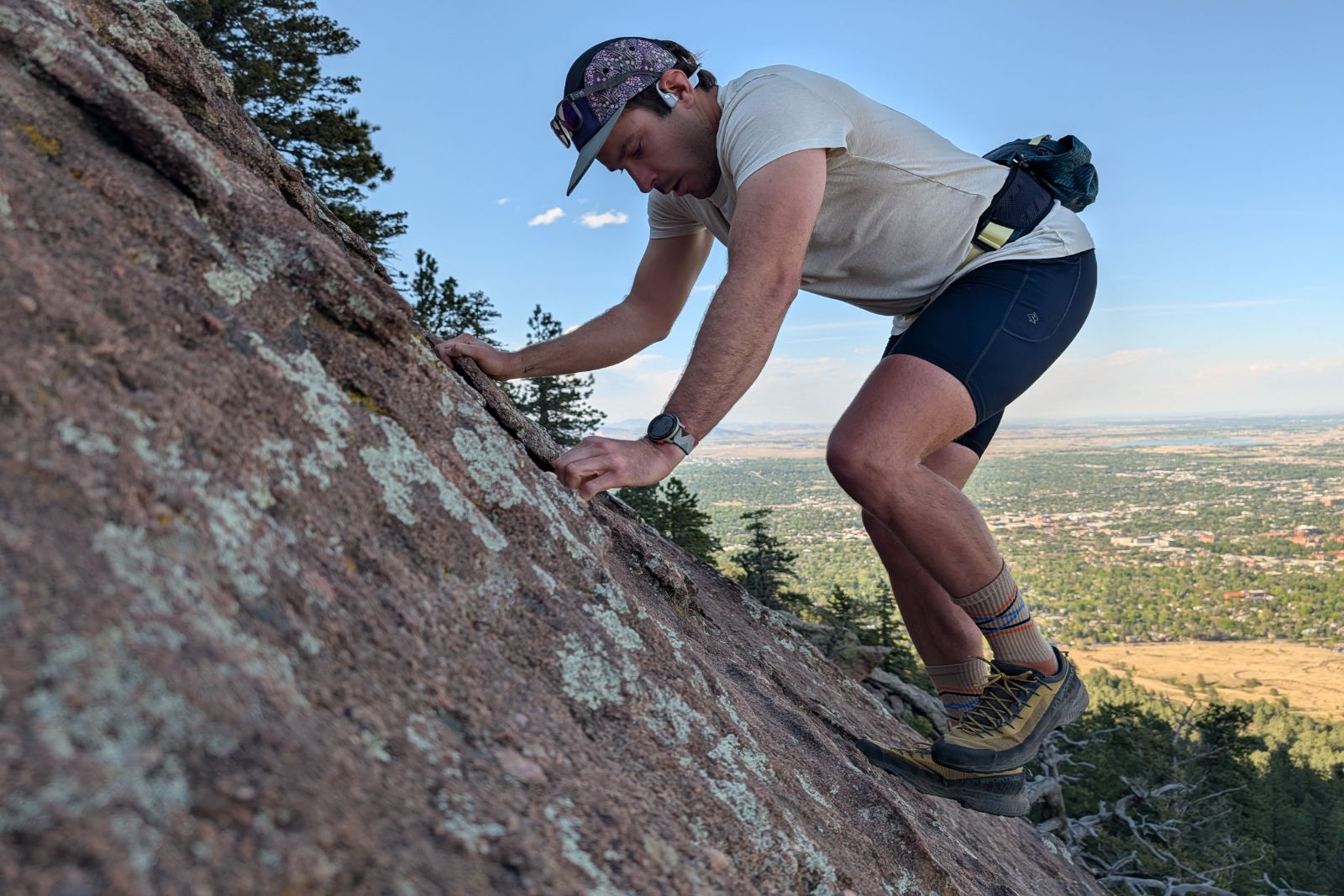 Ascending the Second Flatiron in Boulder, Colorado, while wearing a blue lumbar pack.