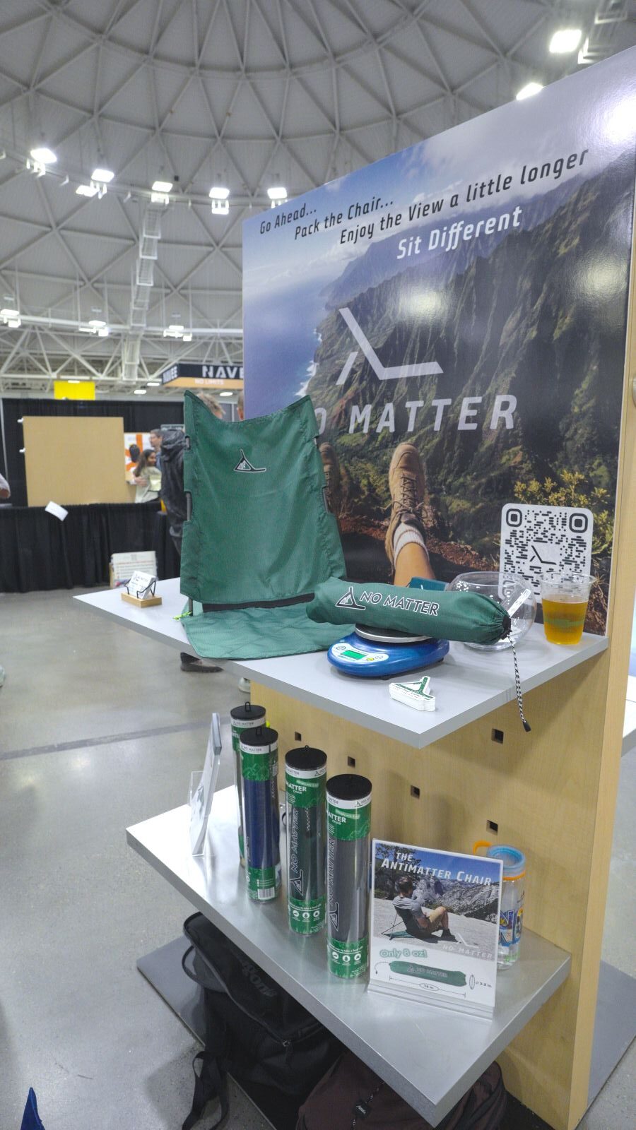 A showfloor display of a green chair.